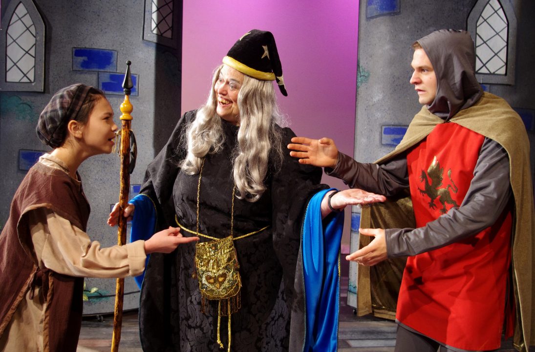 Young Arthur meets Old Arthur while Merlin looks on.